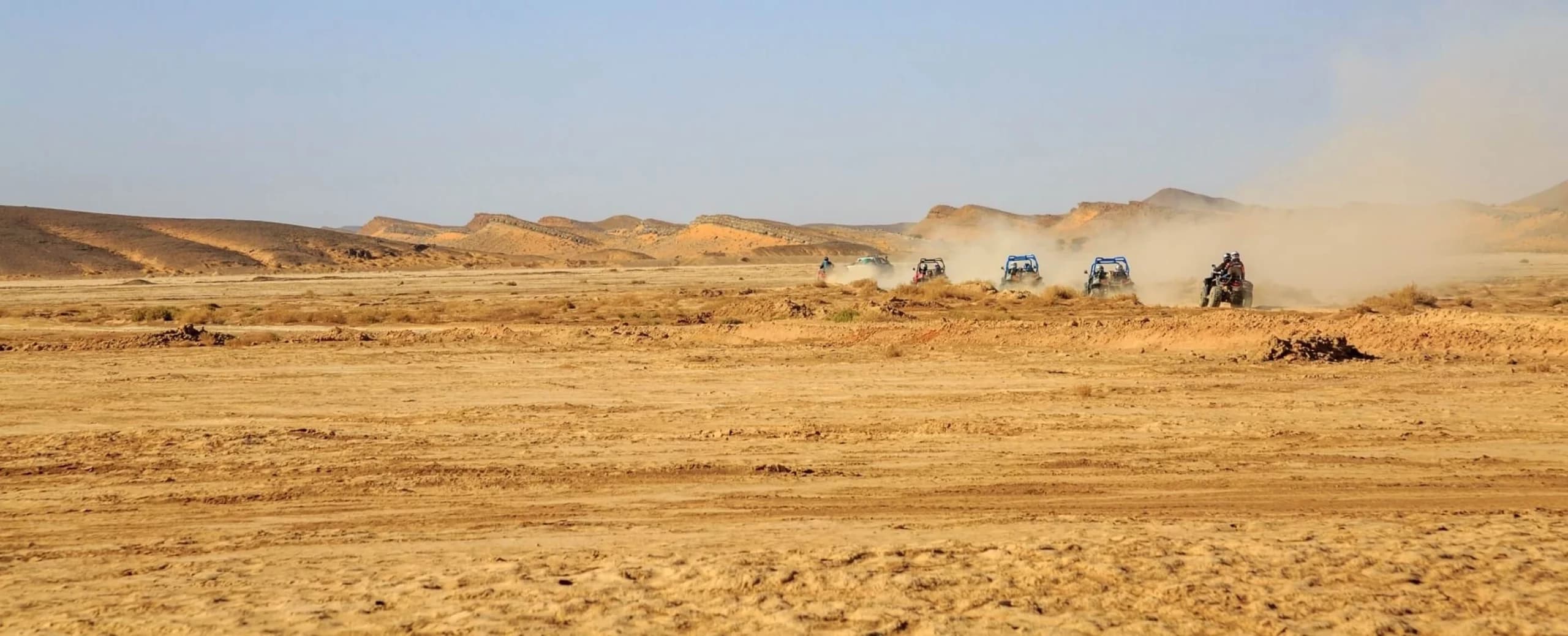 Desert landscape with ATVs